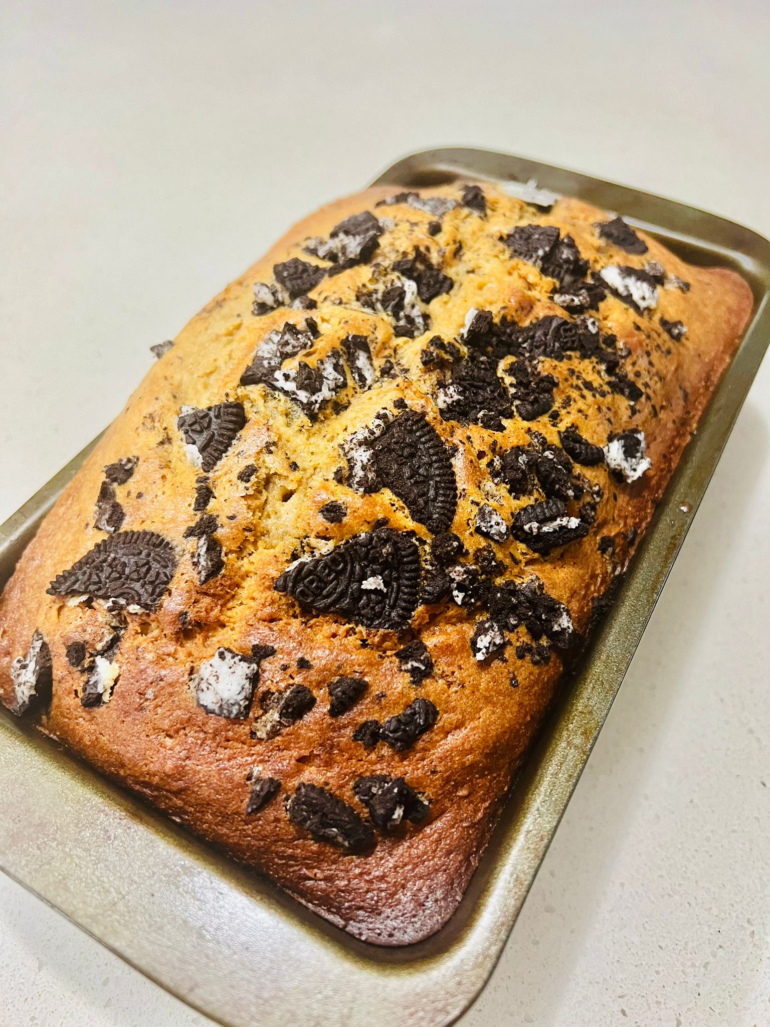 Oreo banana bread loaf studded with Oreo pieces