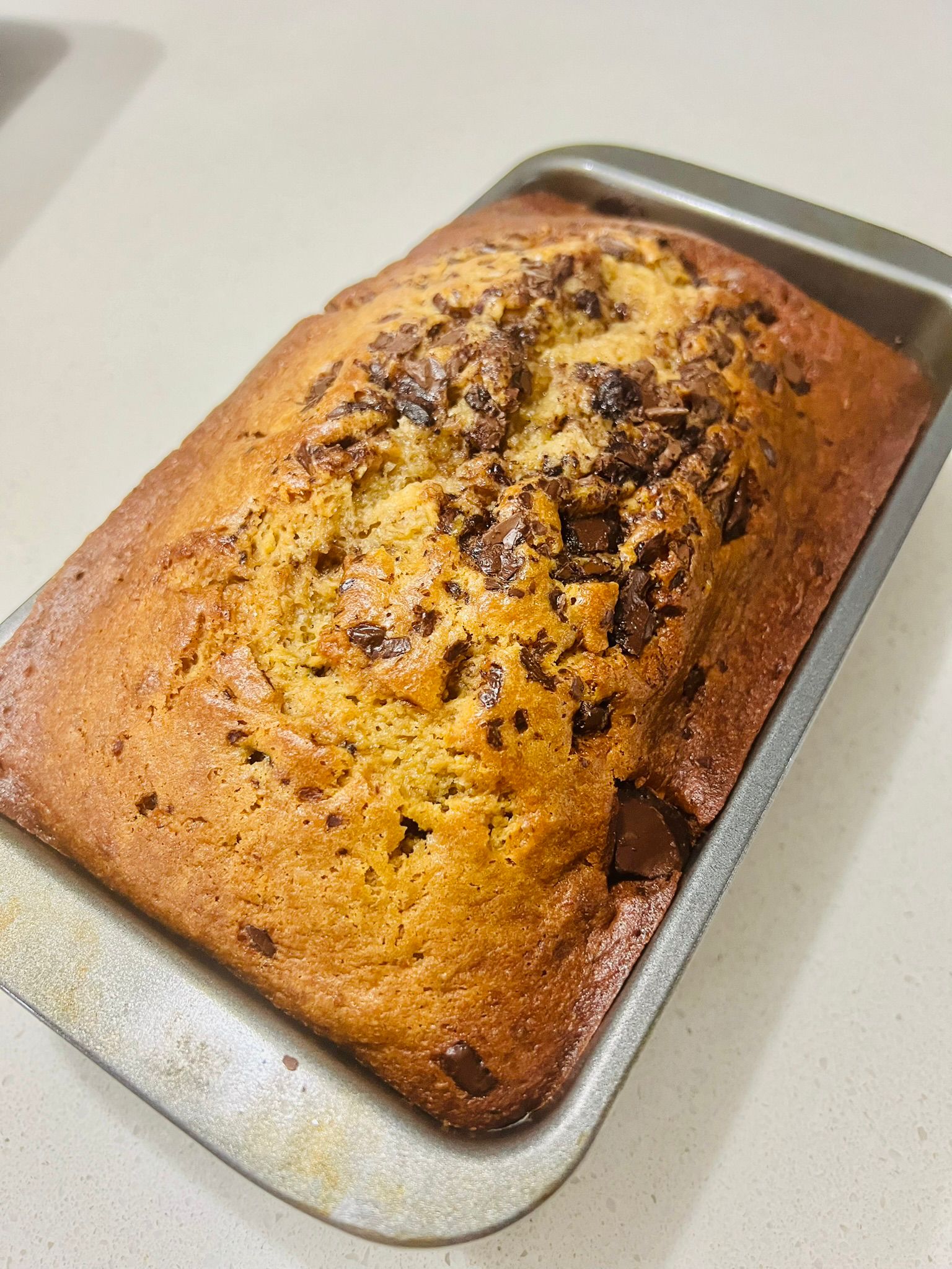 Choc chip banana bread loaf with melty chocolate pieces